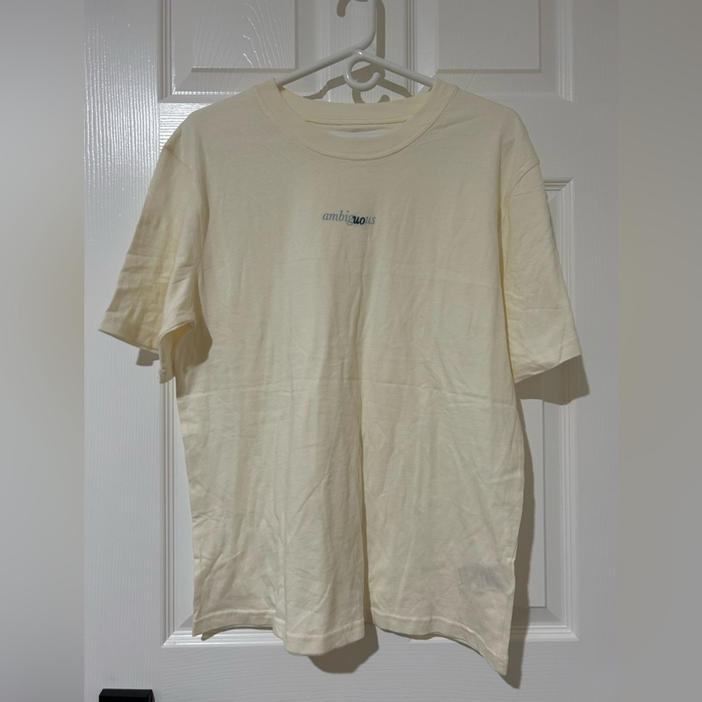 New large UO Urban Outfitters cream colored large T between the lines ambiguous